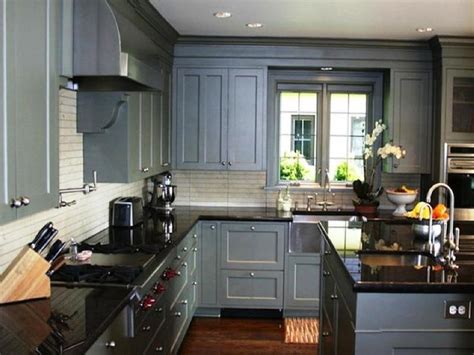 The grey of this kitchen island contrasts the bright white of the cupboards while the backsplash adds a bit of color to the room. This photo about: How to Repair Black Granite Countertops ...