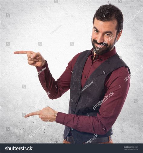 Man Wearing Waistcoat Pointing Lateral Stock Photo 258813329 Shutterstock