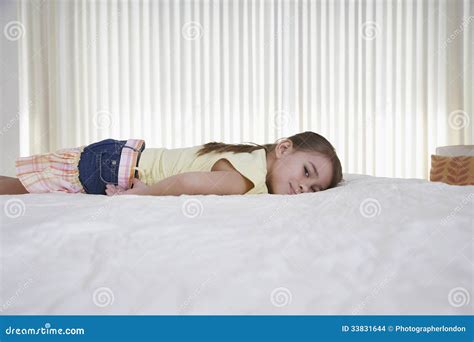 Happy Little Girl Lying In Bed Stock Photo Image Of Pretty Childhood