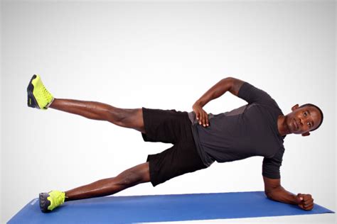 Sporty Man Doing Side Plank With One Leg Raised