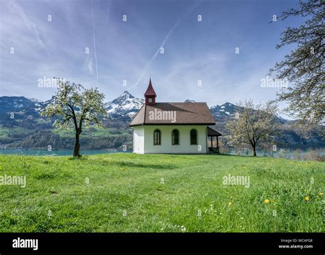 Small White Chapel In A Wonderful Mountain Landscape During Spring With