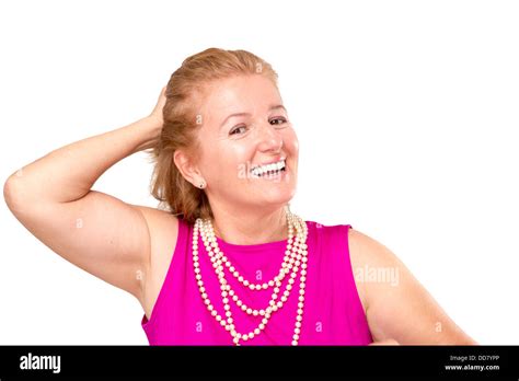 A Blonde Lady Pulling Her Hair Backwards With A Great Smile On Her Face