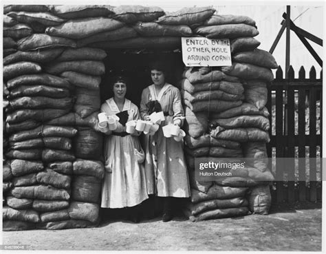 Two Women Stand In The Doorway Of The Ymca Air Raid Shelter In The