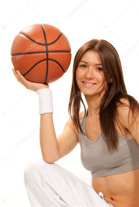 Pretty Brunette Woman Holding Basketball In Hand Stock Photo