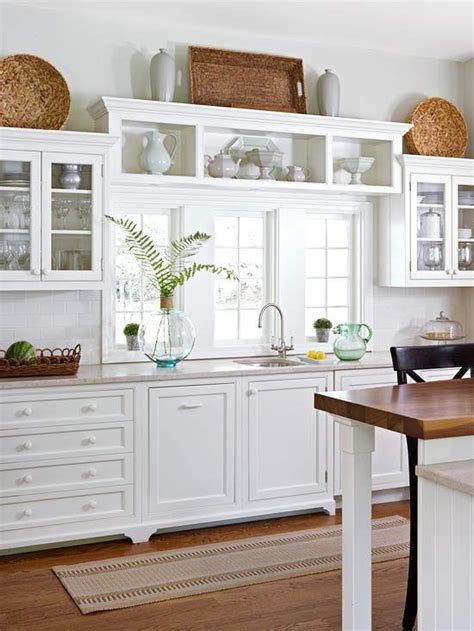 Decorating above your cabinets is a great way to showcase favorite items and keep the supplies you need within reach. Cottage Farmhouse Kitchens {inspiring in white ...