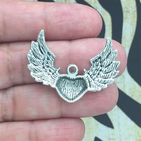 Bulk 12 Angel Wing Charm Heart Silver By Tijc Sp0267b Etsy