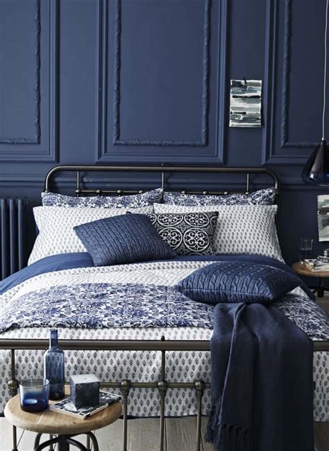 A white painted wall in your bedroom is the perfect idea to add a radiant look to your sanctuary. Learn How To Create A Navy Themed Bedroom