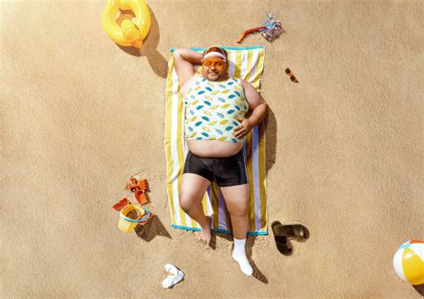 Fat People On The Beach Stock Photos Pictures And Royalty Free Images