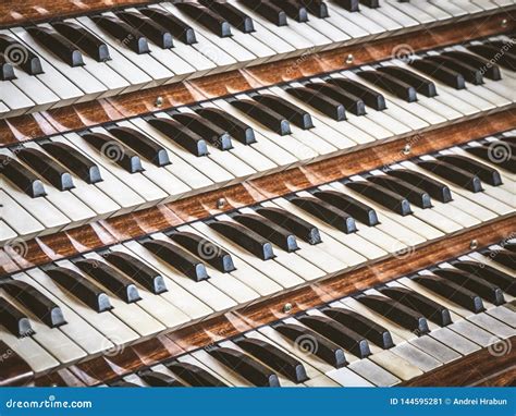 Close Up View Of A Church Pipe Organ With Four Keyboards Stock Image
