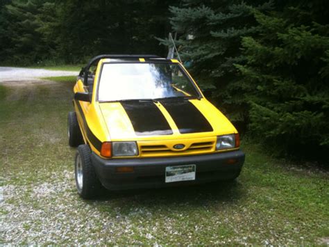 Ford Fiesta Convertible 1993 Yellow With Black Stripes On The Side For