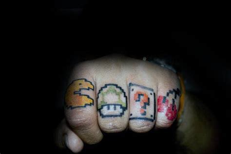 Ribbons are often used to complete the main tattoo. 30 Pacman Tattoo Designs For Men - Arcade Game Ink Ideas