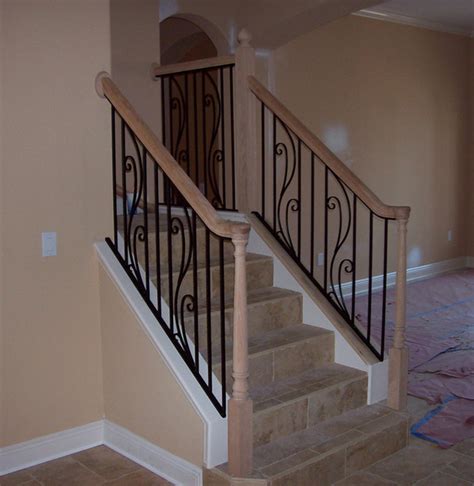 So, we decided to stain the banister and newel posts (and the wood that runs along the base of the spindles) and to paint each of the spindles a creamy white color. Custom wrought iron steel stair rail with spring flower ...