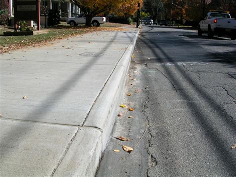 Are cracks in your sidewalk a sign it is time for replacement, or can you repair your concrete sidewalk on your own.? CIty sidewalk repair 038.JPG from Appalachian Paving ...