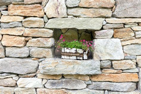 Stone Wall Decorated With Flowers ~ Architecture Photos ~ Creative Market