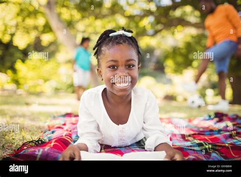 Happy Girl Reading A Book Stock Photo Alamy