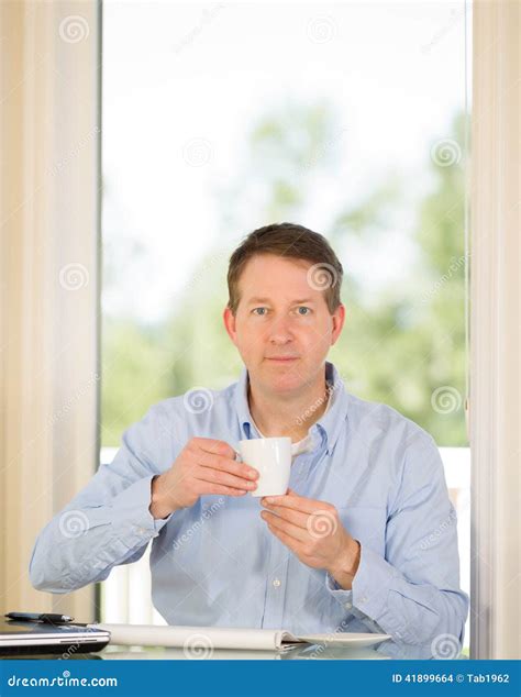 Mature Man Enjoying Coffee While At Work Stock Photo Image Of Office