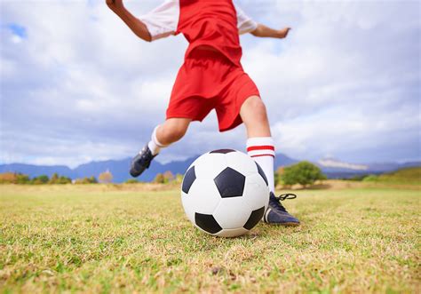 Boy Running After Soccer Ball Hoodoo Wallpaper