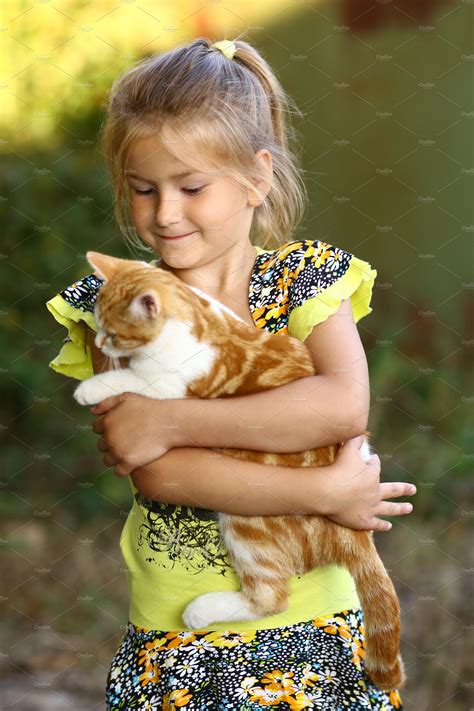 Little Girl Hug Cat Close Up Photo O Stock Photos ~ Creative Market