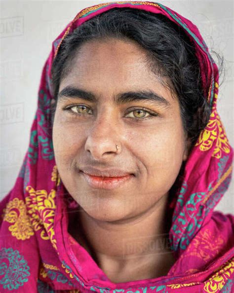 Portrait Of Bangladeshi Woman With Green Eyes And Red Headscarf Stock