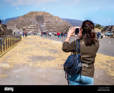 Tourist Taking Photo Of The Pyramid Of The Moon At The Ancient City Of