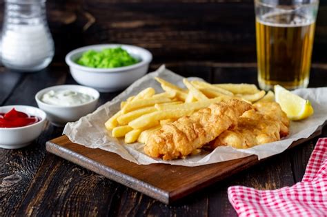 Premium Photo Fish And Chips On A Wooden British Fast Food Recipes