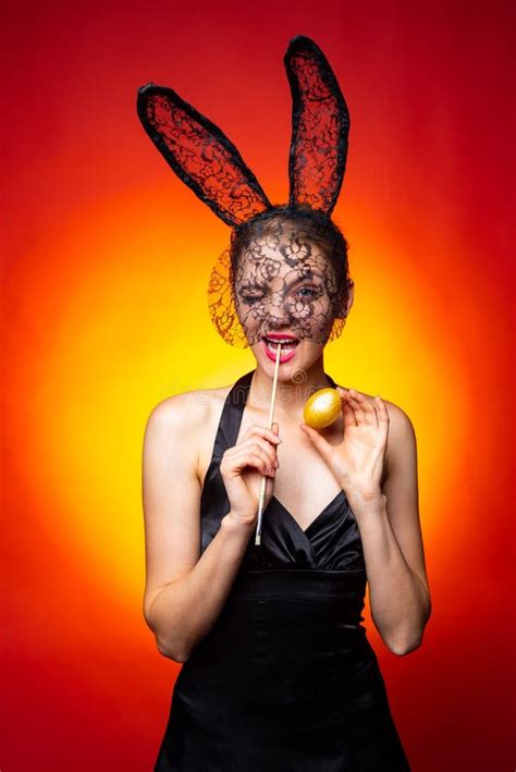 Happy Young Woman Wearing Bunny Ears And Having Easter Eggs Bunny
