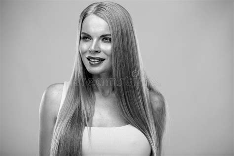 beautiful blonde woman with shiny long straight hair and natural fresh make up fashion beauty