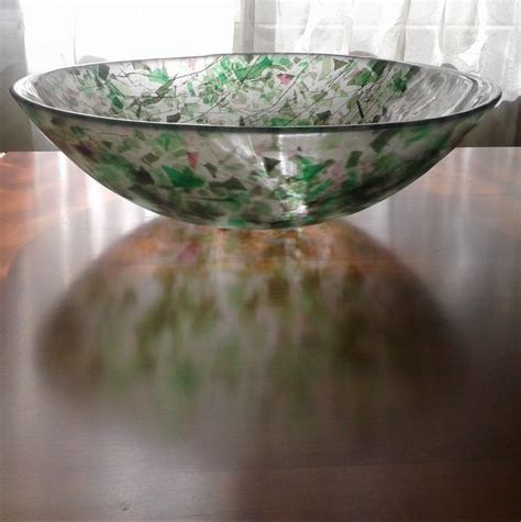 A Glass Bowl Sitting On Top Of A Wooden Table