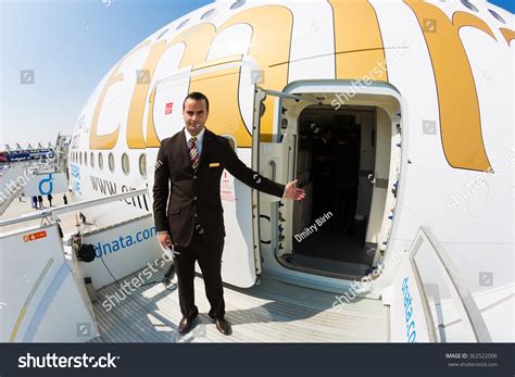 6 Emirates Flight Attendant Welcoming Aboard Passengers Images Stock