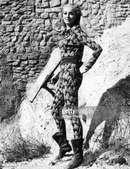 Italian Actress Daniela Bianchi Holding A Gun In A Snakeskin Catsuit