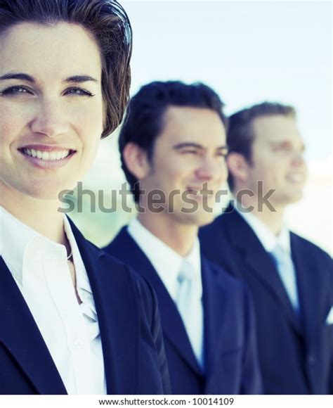 Three Business People Standing Row Looking Stock Photo Edit Now 10014109