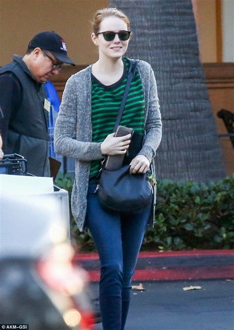 Emma Stone Shows Off A Smile As She Picks Up Flowers On A Grocery Run