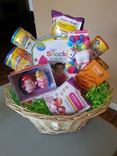 Fill their basket with something thoughtful this year. Baby girls first Easter Basket. Full of yummy goodies, bib ...