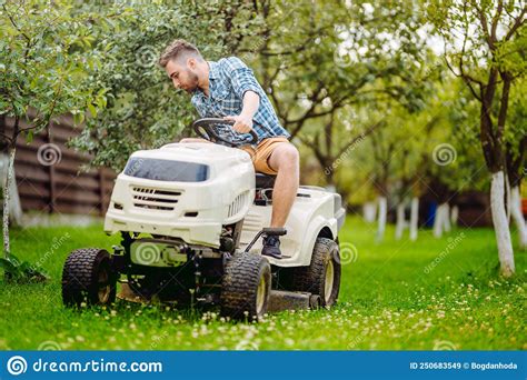Gardening Works With Handsome Man Using Lawn Mower Stock Image Image