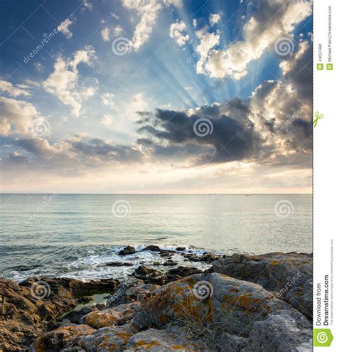 Sea Wave Breaks About Rocky Shore At Sunrise Stock Photo Image Of