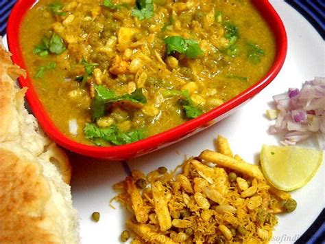 मिसळपाव) is a popular dish from nashik, maharashtra, india. spicy mixed sprout curry served with local bread (misal ...
