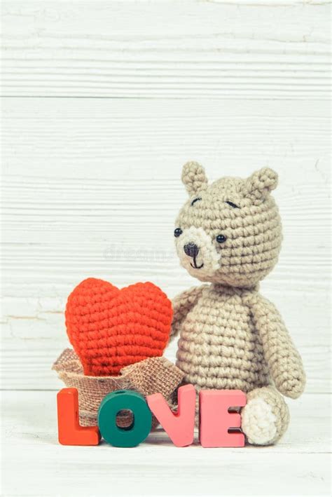 Sweet Teddy Bear Doll With Love Text And Red Knitting Heart On Stock
