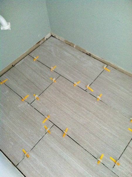 Take the time to lay bathroom tile exactly where you want it without adhering it to the floor just yet. Then came the laying of the tile. Large format tiles are ...
