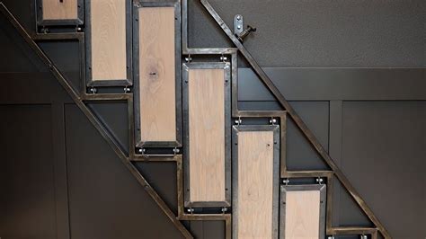 A Modern Folding Staircase That Hangs On The Wall