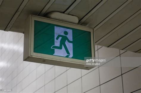 Hanging Emergency Exit Sign High Res Stock Photo Getty Images