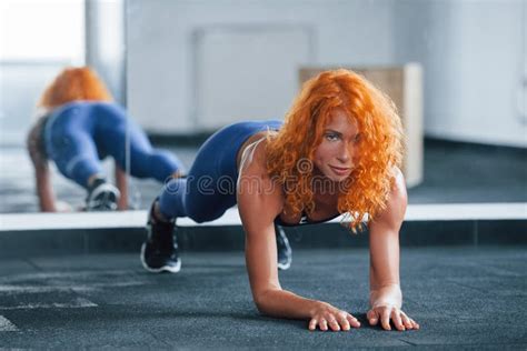 Doing Abs Sporty Redhead Girl Have Fitness Day In Gym At Daytime Stock