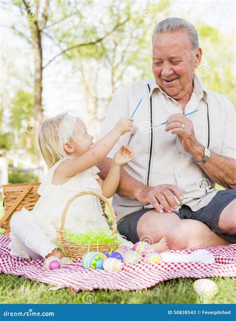 Grandfather And Granddaughter Coloring Easter Eggs On Blanket At Stock Image Image Of Blanket