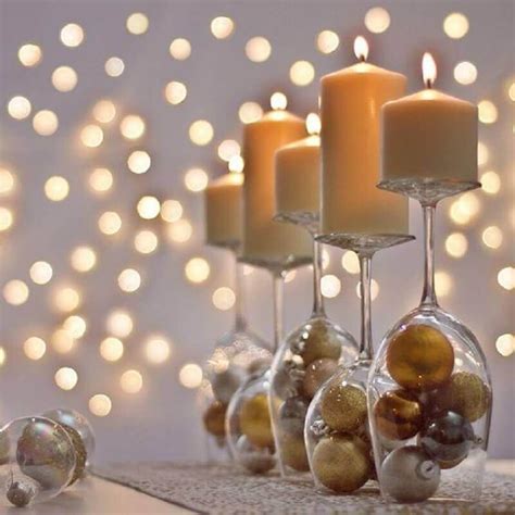 Candles And Ornaments In Wine Glasses On A Table