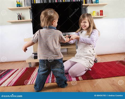 siblings fighting over the remote control stock image image of sibling television 88456785