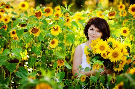 Smiling Woman And Little Girl On Sunflowers Field Stock Photo Image