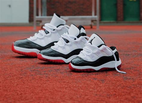 University red contrasting accents, black detailing around the inner collar atop a translucent outsole completes the design. Que vaut la Air Jordan 11 XI Retro Low Concord Bred AV2187 ...