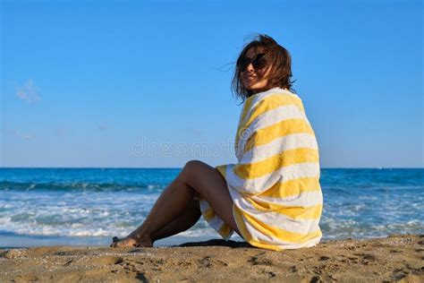 Mature Beautiful Woman With Beach Towel Sitting On Sand Woman Enjoying Sea Sunset Landscape