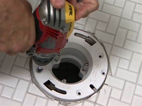 Toilet flange tile guide with debris shield, makes tiling a bath floor easier while protecting the sub floor. How to Anchor a Toilet Flange in a Tile Floor | Bathroom