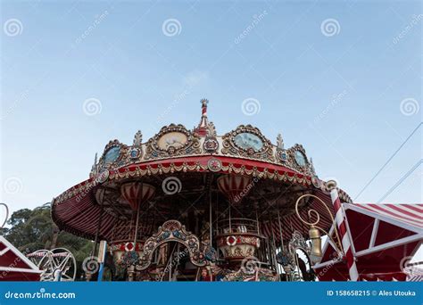 Gorgeous Vintage Carousel In An Amusement Park On A Background A Blue