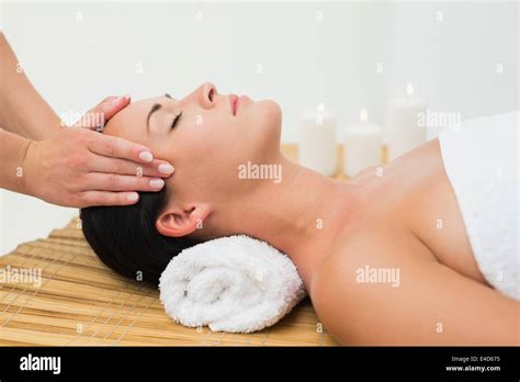 Peaceful Brunette Enjoying A Facial Massage Stock Photo Alamy